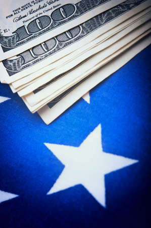 american dollars bills on flag backgroundの写真素材