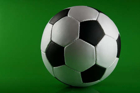 football ball on green backgroundの写真素材