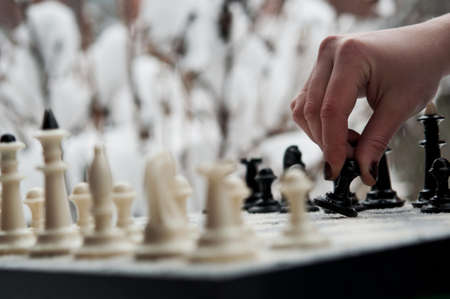 woman play winter chess gameの写真素材