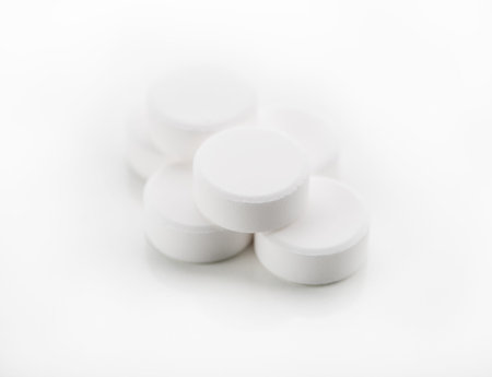 closeup of pills on white background