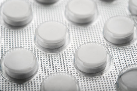 white tablet pills on background