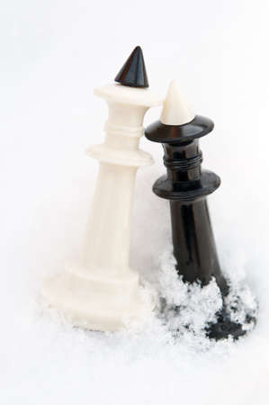 winter chess pieces on snowの写真素材
