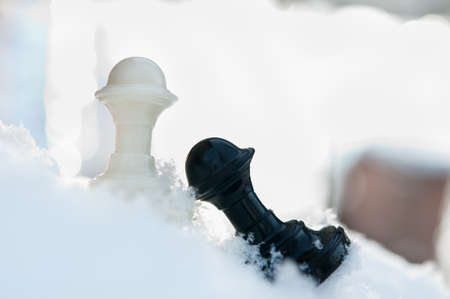 winter chess pieces pawn on snowの写真素材