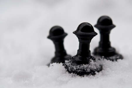 winter chess pieces pawn on snowの写真素材