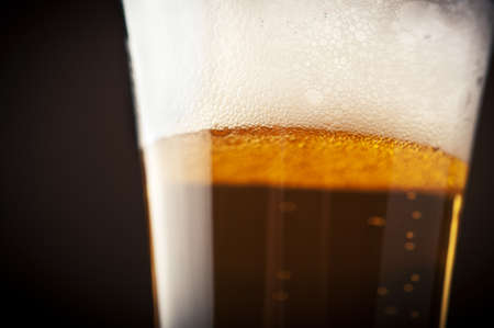 close up of beer bubbles on glassの写真素材