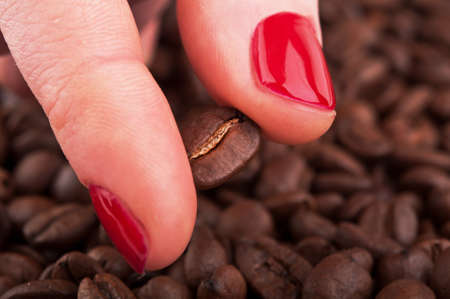 woman holding roasted coffee beanの写真素材