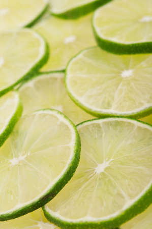 fresh green limes on backgroundの写真素材