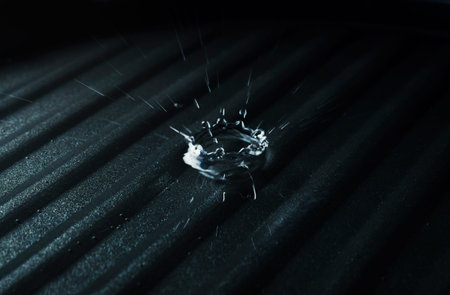 water splash on dark backgroundの写真素材