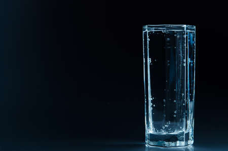 glass with water on backgroundの写真素材