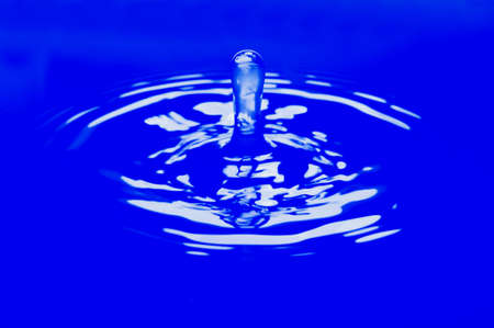 water splash on blue backgroundの写真素材