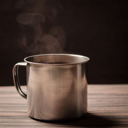 hot cup of coffee on black backgroundの写真素材