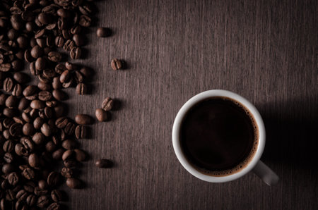 cup of coffee and roasted beans