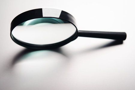 Magnifying glass on a background