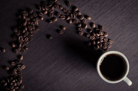 coffee cup with roasted beans