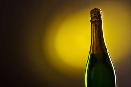 champagne bottle on yellow backgroundの写真素材