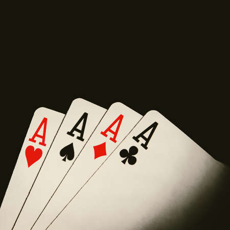 four poker cards on backgroundの写真素材