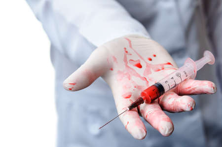 doctor with syringe blood isolated on white backgroundの写真素材