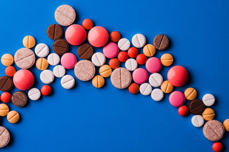 colorful tablets on blue backgroundの写真素材
