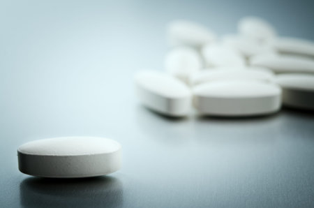 white capsule on a tableの写真素材