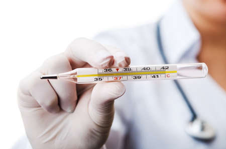 doctor holding thermometer isolated on white backgroundの写真素材