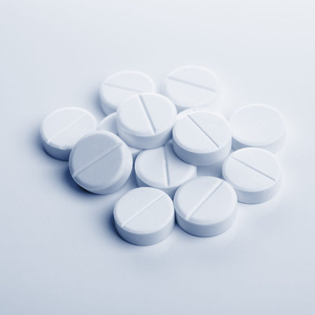 pile of white tablets on table