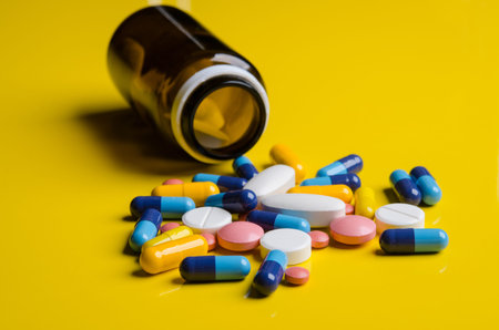 pills with bottle on yellow background