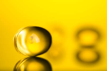 close up of capsule on yellow backgroundの写真素材
