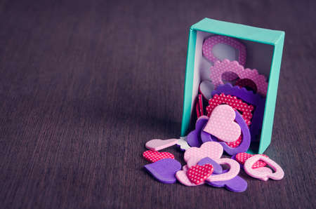 box with hearts on wooden backgroundの写真素材