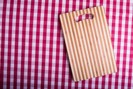 Cutting board on tartan tableの写真素材