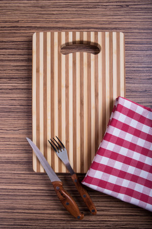 cutting board on a wood background