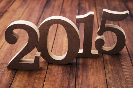wooden numbers 2015 on background
