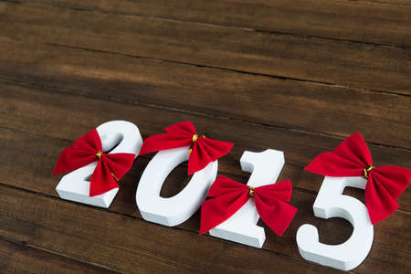 White big numbers with red bow on backgroundの写真素材