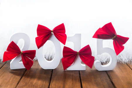 White big numbers with red ribbons on backgroundの写真素材