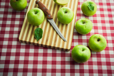 delicious grenn apples on tablecloth tartanの写真素材