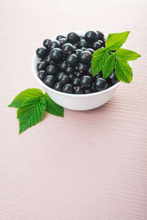fresh currant berry on wooden backgroundの写真素材