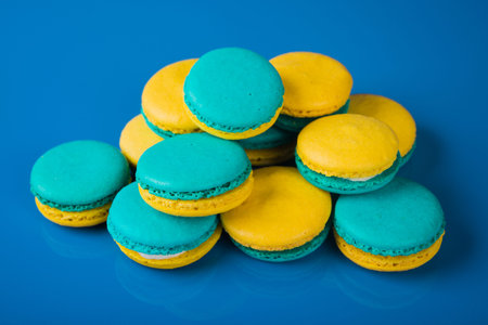 Lemons macaroons on blue background