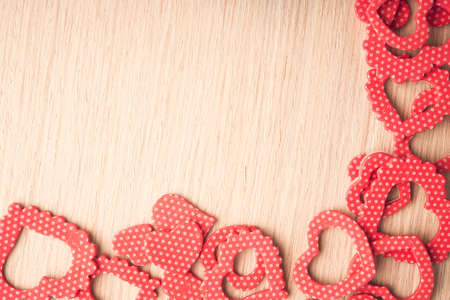 Hearts shape symbol on wooden background. Valentine Day decoration.の写真素材