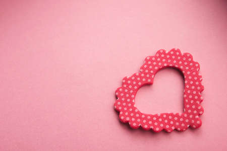 One red heart on pastel backgroundの写真素材