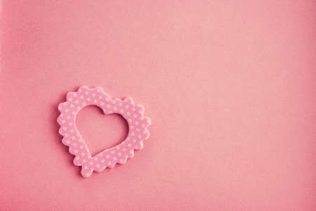 Romance symbol heart on pink backgroundの写真素材