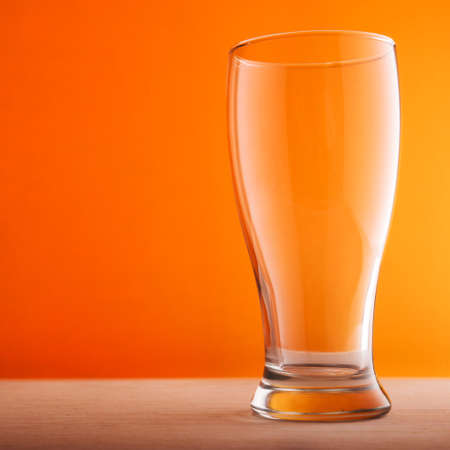Empty glass of beer on backgroundの写真素材