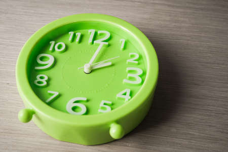 big clock on wood backgroundの写真素材