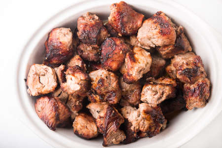 shashlik chips meat on white plateの写真素材