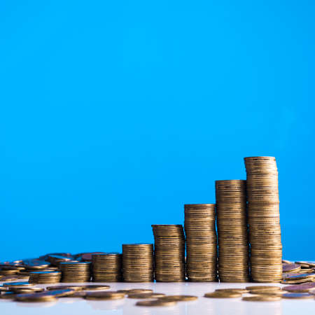 Gold stack of coins on backgroundの写真素材