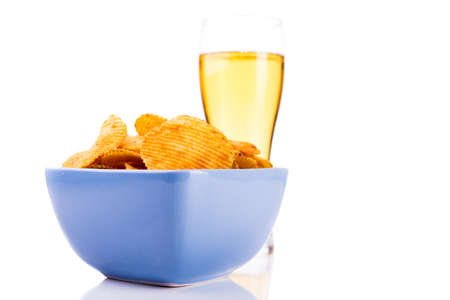 Potato chips with beer isolated on white backgroundの写真素材