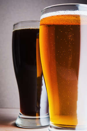 Two beer mugs on wood tableの写真素材