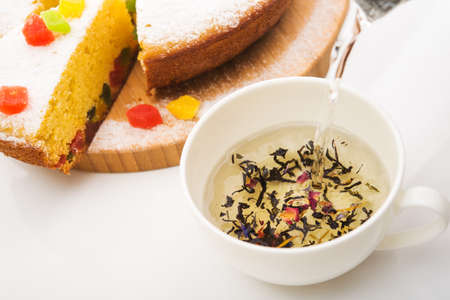 Close up of natulal hot tea with pie isolated on white backgroundの写真素材