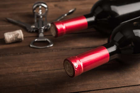 Alcohol background with wine and metal corkscrewの写真素材
