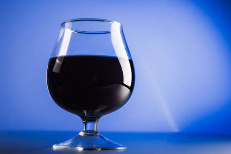 Glass of brandy on background.の写真素材