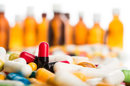 Pills and tablets on bottles backgroundの写真素材