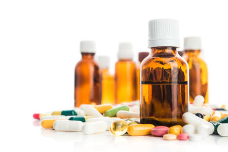 Pills, vitamin with bottles isolated on white backgroundの写真素材